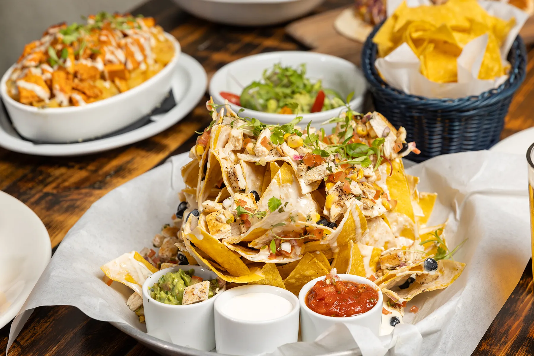 Loaded nachos with guacamole and salsa.
