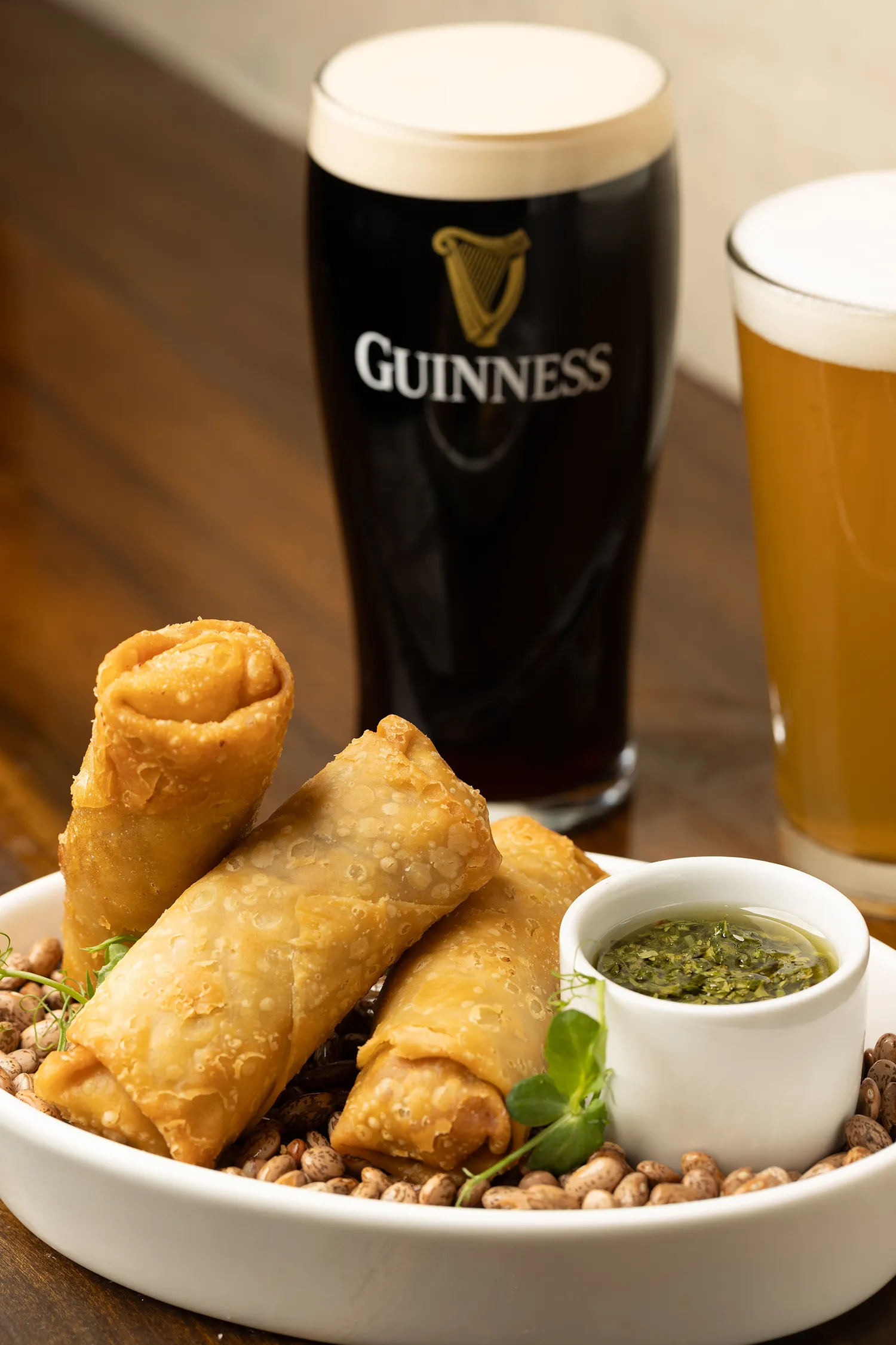 Fried spring rolls with Guinness and wheat beer.
